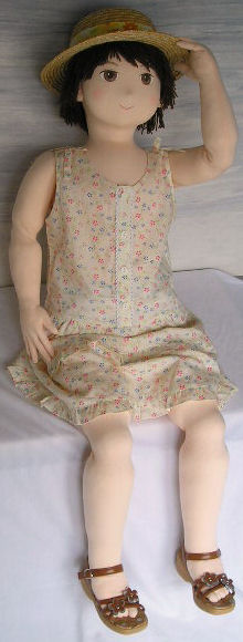 Life size doll in sundress