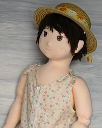 Girl doll in sundress